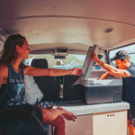 Dometic CFF35 in a old camper with a person taking something out of the coolbox and a woman helping him.