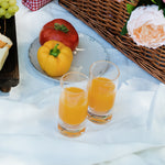 Flamefield longdrinkglas Slim Jim Short Clear 290 ml (set van 4) – onbreekbaar, kristalhelder, acryl met jus dorange in een glas en schaal met paprika's
