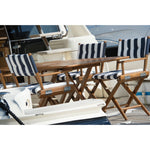 Klaptafel San Remo teak met blokrooster en regisseursstoelen met navy-witte kussens