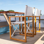 Varechin Victor teakhouten regisseurstoelen aan tafel op een luxe boot