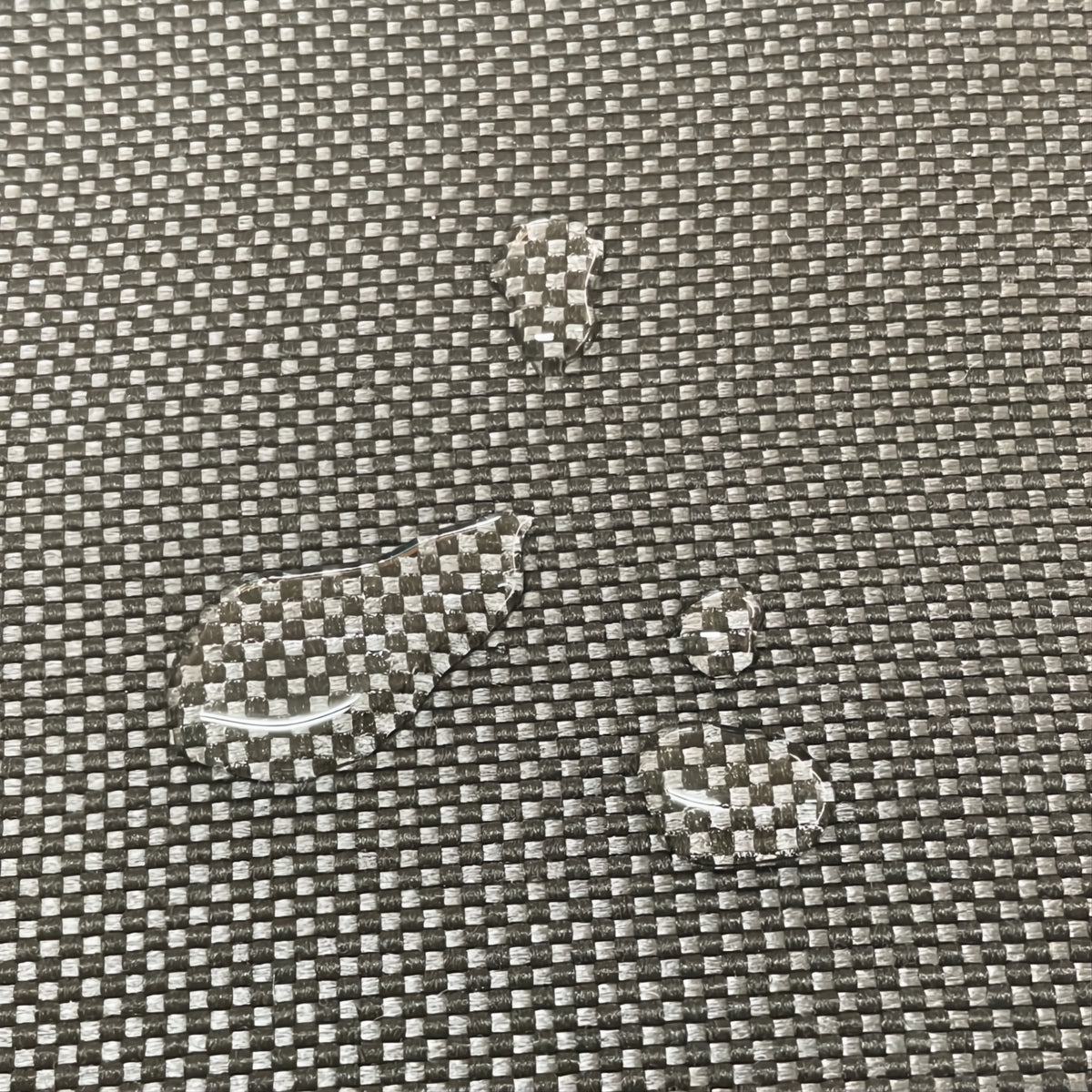 Waterproof_kussens textiel met een waterdruppel