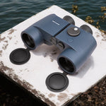 Weems & Plath Sport verrekijker 7x50 Wayfinder met kompas on a table